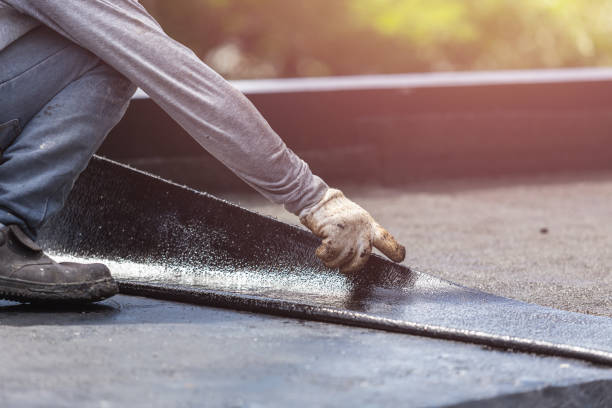 Professional Basement Waterproofing technician working in Port Jefferson Station, NY